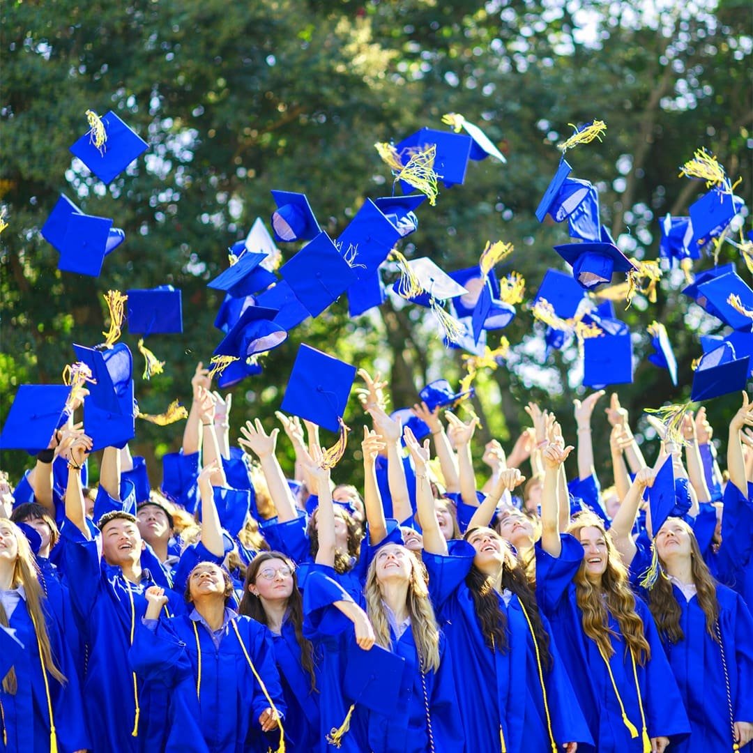 Graduates of a certified University-Model® school in caps and gowns at commencement